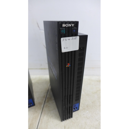 5054 - Two Playstation 2 consoles including power cables etc.