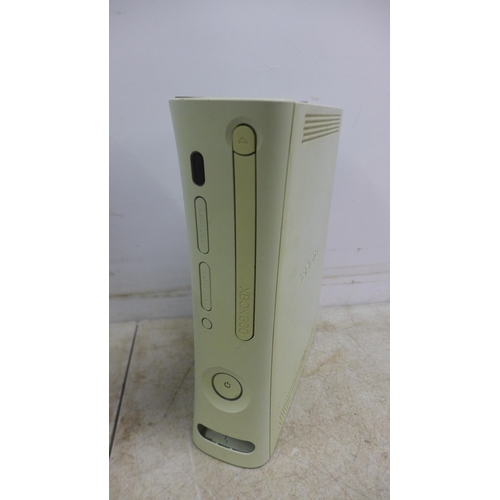 5056 - A boxed 250GB XBox 360S console with wireless controller and power supply and one other XBox 360 con... 