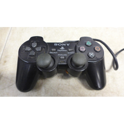 5058 - Three Playstation 2 consoles with two PlayStation controllers and two sets of power cables and AV ca... 