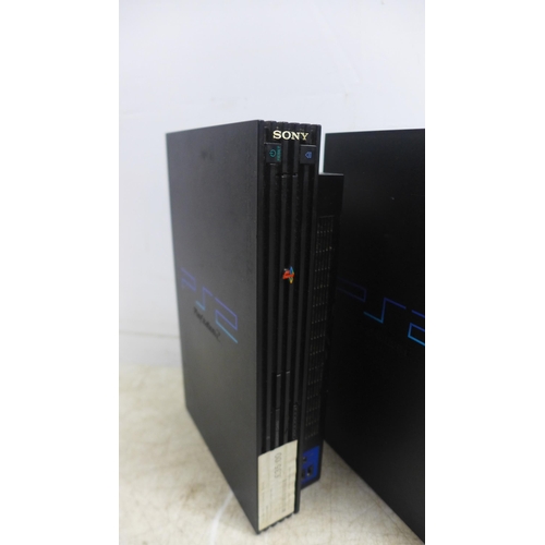 5058 - Three Playstation 2 consoles with two PlayStation controllers and two sets of power cables and AV ca... 