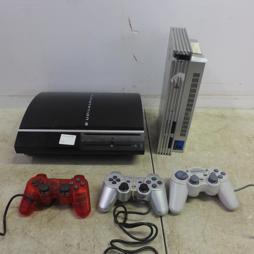 5060 - A Sony Playstation 3 (model: CECHK03) console and a Sony Playstation 2 (silver edition) with assorte... 