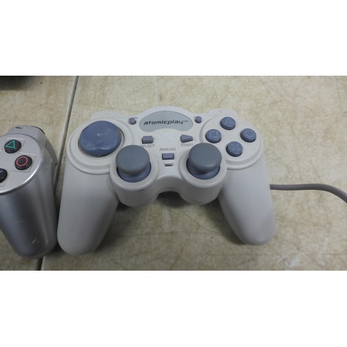 5060 - A Sony Playstation 3 (model: CECHK03) console and a Sony Playstation 2 (silver edition) with assorte... 