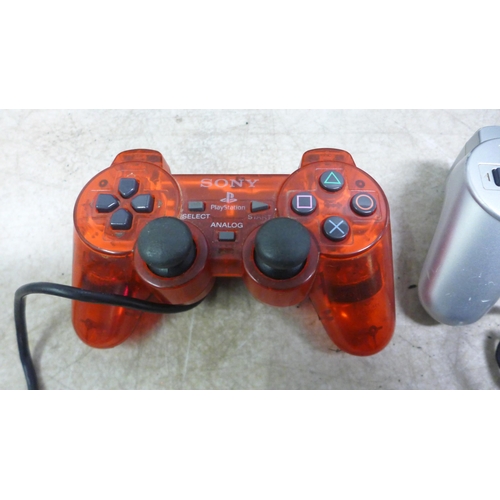 5060 - A Sony Playstation 3 (model: CECHK03) console and a Sony Playstation 2 (silver edition) with assorte... 