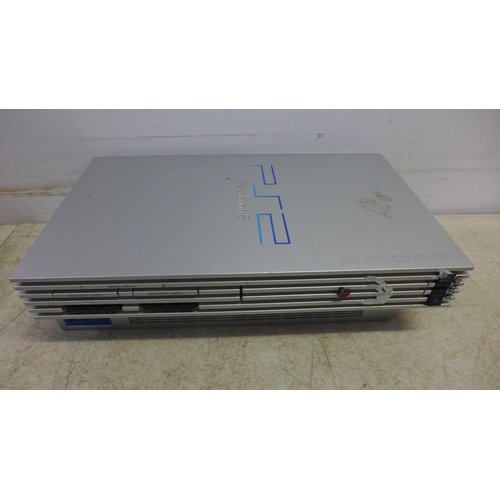 5060 - A Sony Playstation 3 (model: CECHK03) console and a Sony Playstation 2 (silver edition) with assorte... 