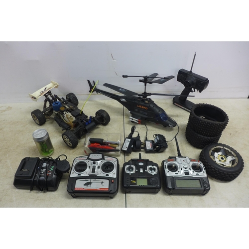 5063 - A collection of remote controlled vehicles including a Lie-Bro 8019 figures copter,a Condor petrol p... 