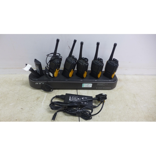 5071 - A set of six Hytera HYT TC-610 two way walkie-talkie radios, two spare batteries and a HYT 6-unit ch... 