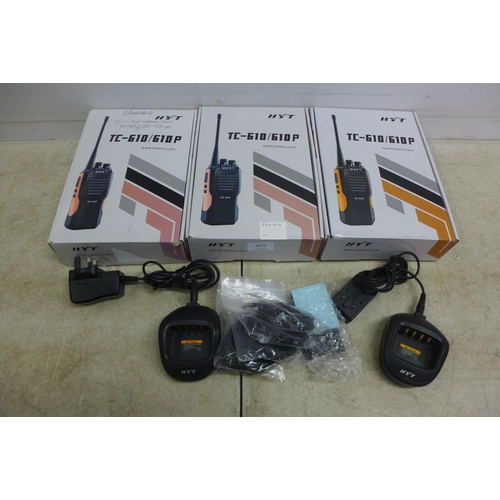 5077 - Three boxed Hytera HYT TC-610 two way walkie-talkie radios - complete with charging docks and two sp... 