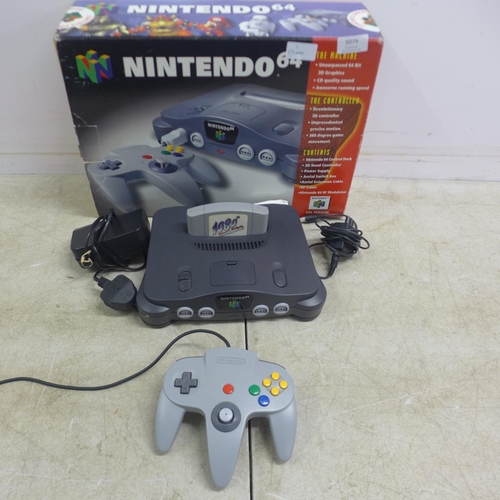 5079 - A boxed Nintendo 64 games console with Nintendo 64 controller pad, power cable, user manuals and two... 