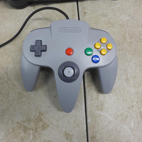 5079 - A boxed Nintendo 64 games console with Nintendo 64 controller pad, power cable, user manuals and two... 