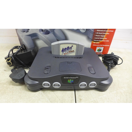 5079 - A boxed Nintendo 64 games console with Nintendo 64 controller pad, power cable, user manuals and two... 