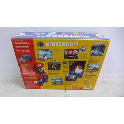 5079 - A boxed Nintendo 64 games console with Nintendo 64 controller pad, power cable, user manuals and two... 