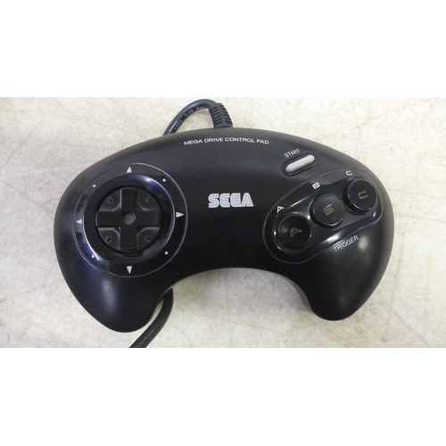 5080 - A Sega Mega Drive II 16-bit games console with a six game Mega Games cartridge including World Cup I... 