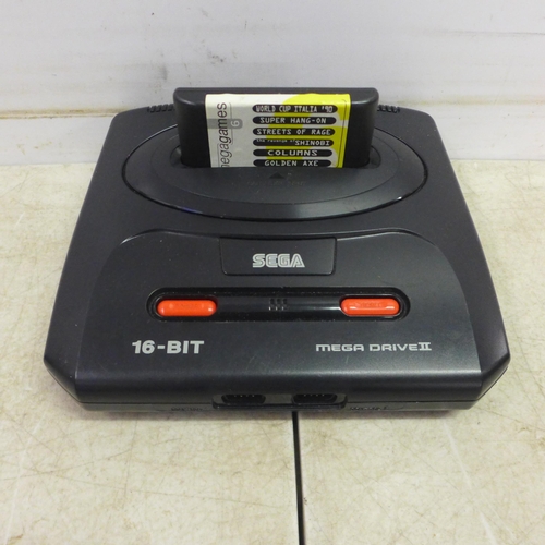 5080 - A Sega Mega Drive II 16-bit games console with a six game Mega Games cartridge including World Cup I... 