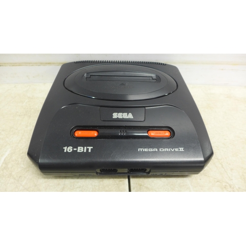 5080 - A Sega Mega Drive II 16-bit games console with a six game Mega Games cartridge including World Cup I... 