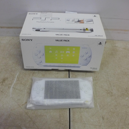 5084 - A Sony PlayStation PSP-1003 KCW portable PlayStation console - ceramic white - with box, battery pac... 