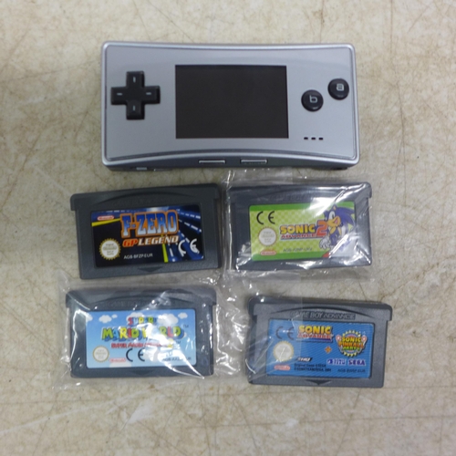 5090 - A Gameboy Micro MEH101 mini gaming console with four games including Sonic Advance, Sonic Advance 2,... 