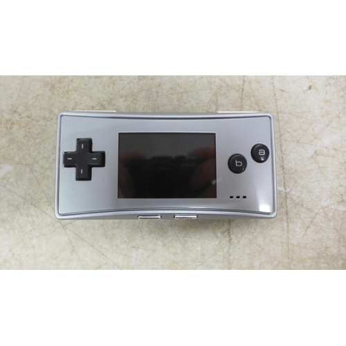 5090 - A Gameboy Micro MEH101 mini gaming console with four games including Sonic Advance, Sonic Advance 2,... 