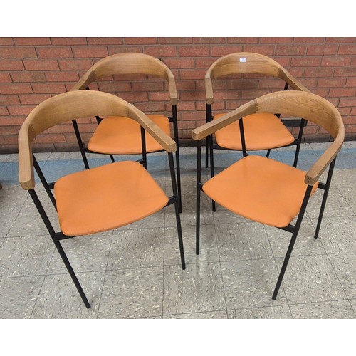 86 - A set of four Danish style ash, tan vinyl and black metal dining chairs