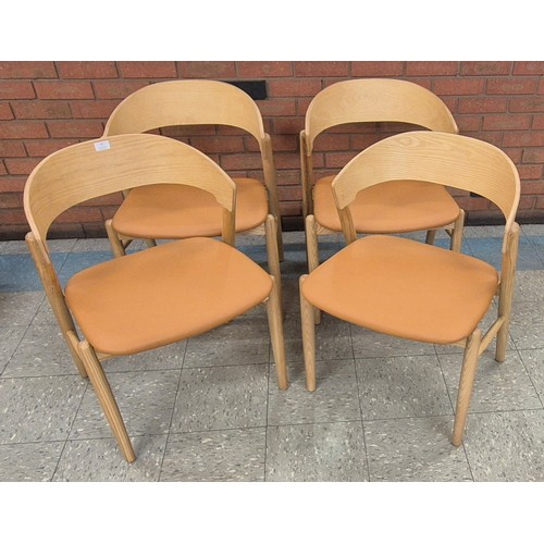 87 - A set of four Danish style ash and tan vinyl dining chairs