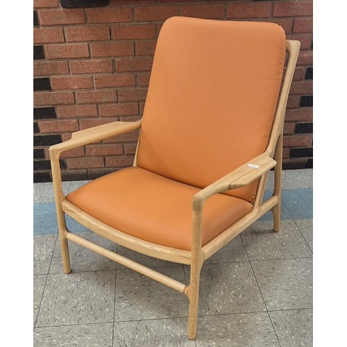 89 - A Danish style ash and tan vinyl armchair