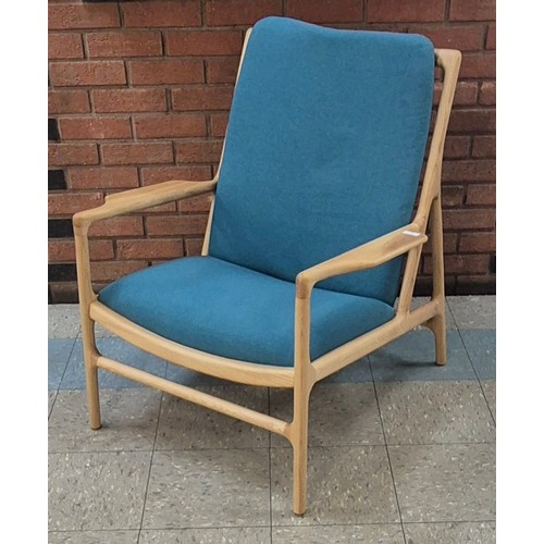 91 - A Danish style ash and turquoise fabric armchair