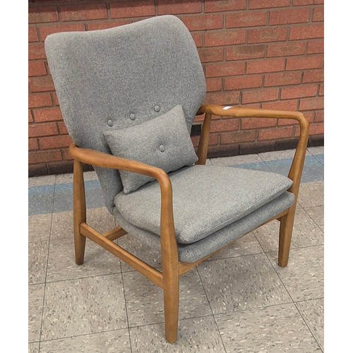 95 - A Danish style teak and grey fabric armchair