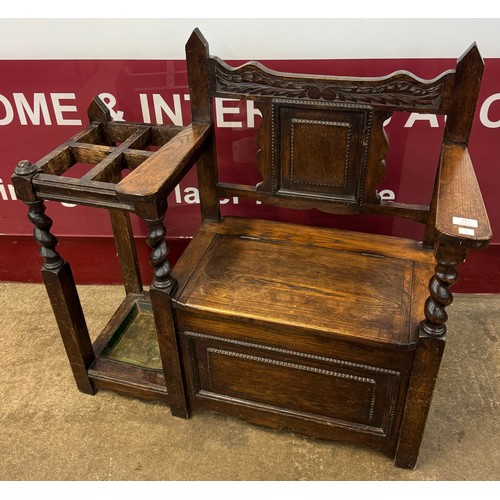 152 - An early 20th Century carved oak hall seat/stick stand