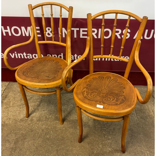 160 - A pair of early 20th Century beech bentwood elbow chairs