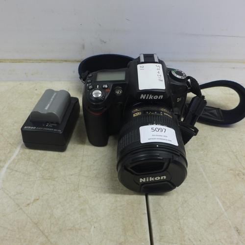 5097 - A Nikon D90 digital SLR camera with a Nikon DX AF-S Nikkor 18-70mm Aspherical lens - with battery an... 