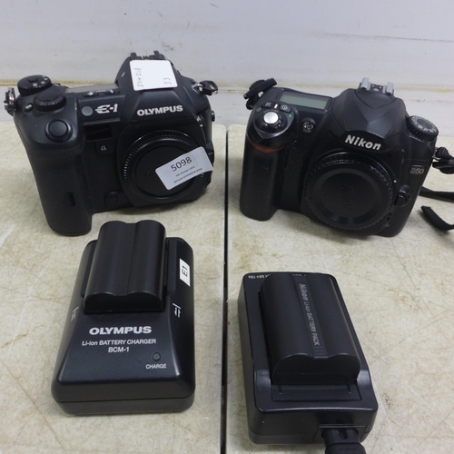 5098 - An Olympus E-1 digital camera and a Nikon D-50 digital camera - both sold with battery and charger