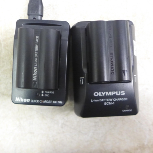 5098 - An Olympus E-1 digital camera and a Nikon D-50 digital camera - both sold with battery and charger