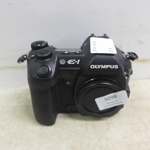 5098 - An Olympus E-1 digital camera and a Nikon D-50 digital camera - both sold with battery and charger