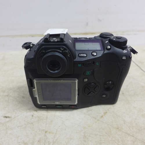 5098 - An Olympus E-1 digital camera and a Nikon D-50 digital camera - both sold with battery and charger