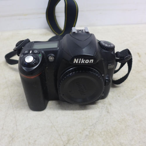 5098 - An Olympus E-1 digital camera and a Nikon D-50 digital camera - both sold with battery and charger