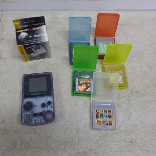 5102 - A Gameboy Colour CGB-001 with 5 games including Pokemon Gold, Tomb Raider, Donkey Kong Country, etc.... 