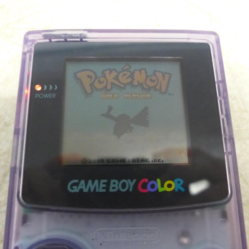 5102 - A Gameboy Colour CGB-001 with 5 games including Pokemon Gold, Tomb Raider, Donkey Kong Country, etc.... 