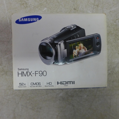 5103 - A Samsung HMX-F90 digital camcorder (boxed), a Canon Powershot SX700 HS digital camera (boxed), a Fu... 