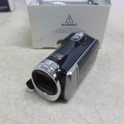 5103 - A Samsung HMX-F90 digital camcorder (boxed), a Canon Powershot SX700 HS digital camera (boxed), a Fu... 