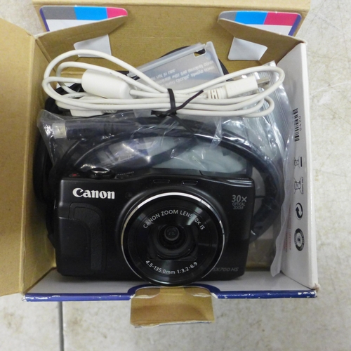 5103 - A Samsung HMX-F90 digital camcorder (boxed), a Canon Powershot SX700 HS digital camera (boxed), a Fu... 