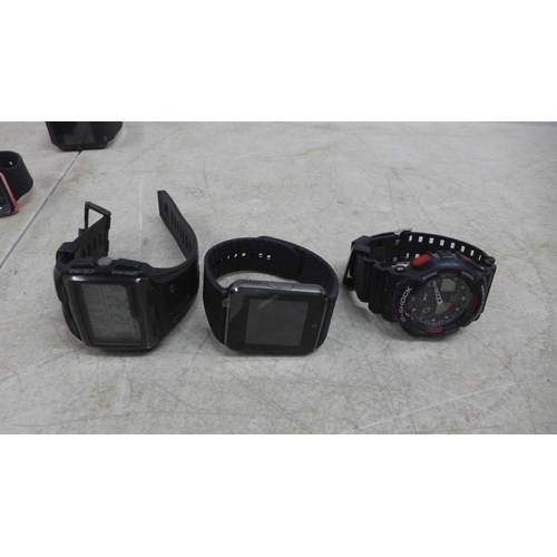 5104 - A quantity of digital watches and smart watches including an Armani Exchange AXT2007 connected smart... 