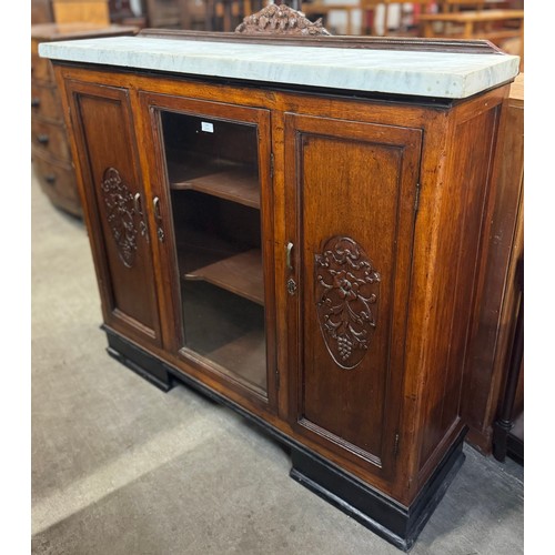 165 - An early 20th Century French oak and marble topped bookcase