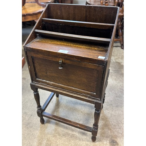 172 - An early 20th Century oak magazine rack