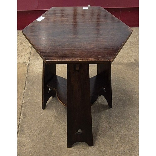 112 - An Arts & Crafts oak hexagonal topped occasional table