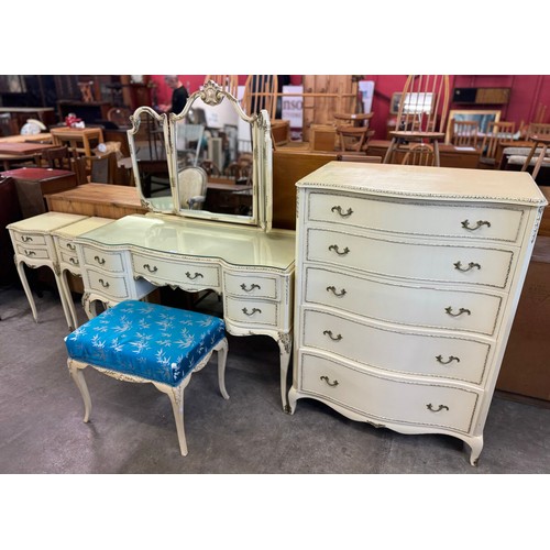 176 - A French style cream and parcel gilt bedroom suite, comprising; dressing table, stool, pair of bedsi... 