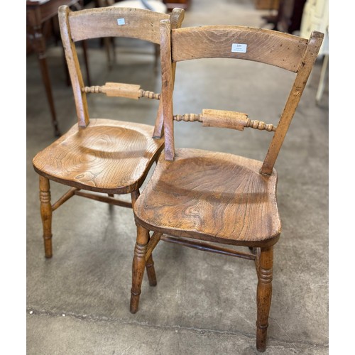 184 - A pair of Victorian elm and beech kitchen chairs