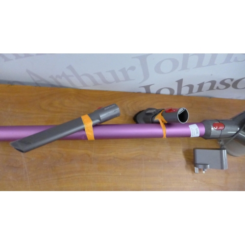 5181 - A Dyson V8 cordless vacuum with attachments and charger