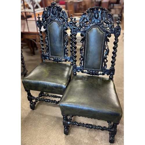 185 - A pair of Victorian carved ebonised and green leather hall chairs