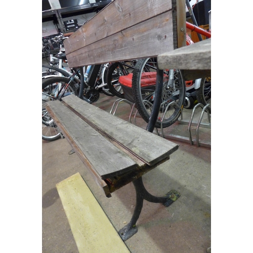 5186 - A wooden bench with cast iron frame