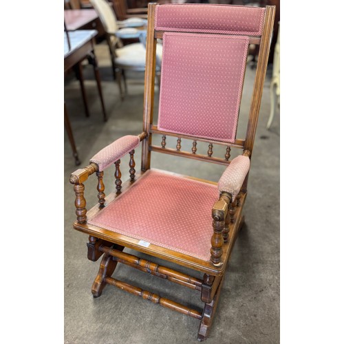 187 - An American beech and fabric upholstered rocking chair