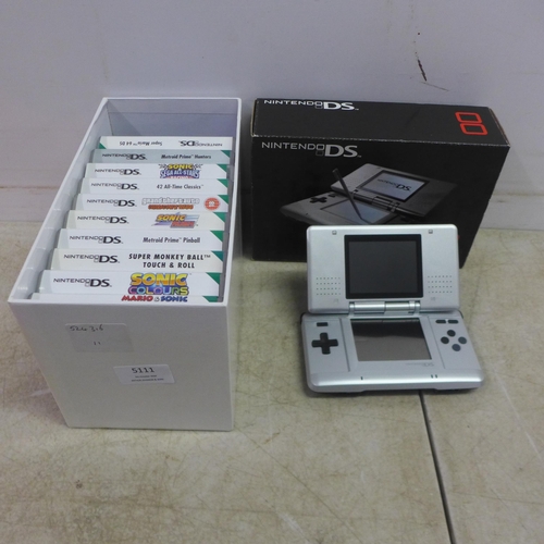 5111 - A Nintendo DS NTR-001 hand held gaming console with a box of 15 games